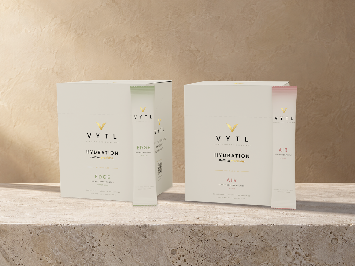 VYTL EDGE and AIR electrolyte boxes on a sunlit stone ledge