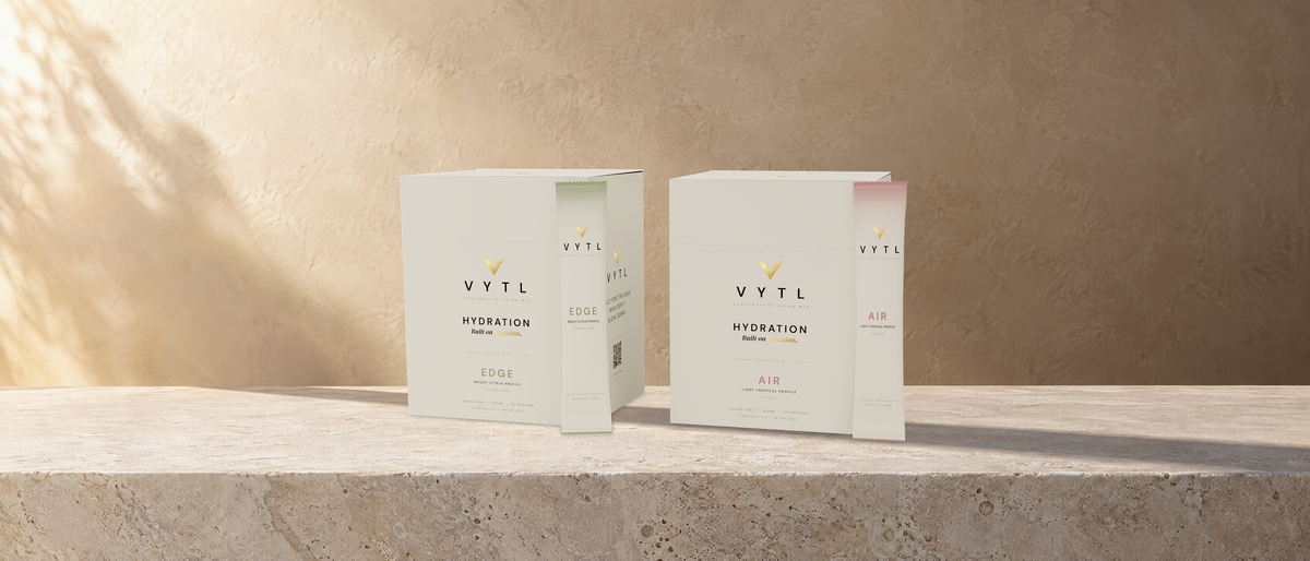 VYTL EDGE and AIR electrolyte boxes on a sunlit stone ledge