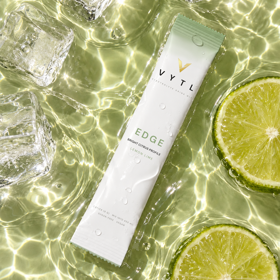 VYTL EDGE Lemon Lime electrolyte stick in water with lime and ice