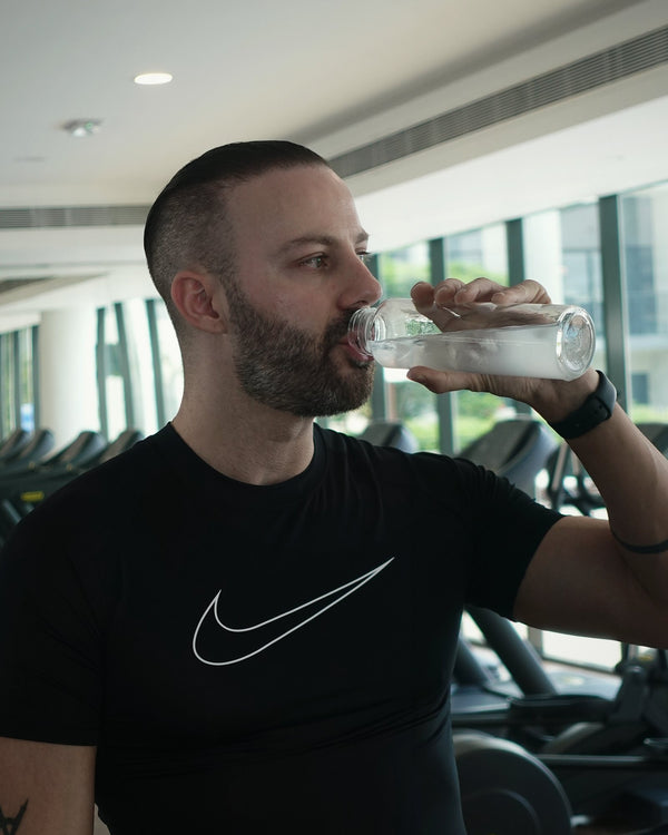 Teddy Bechara, founder of VYTL, drinking VYTL at the gym